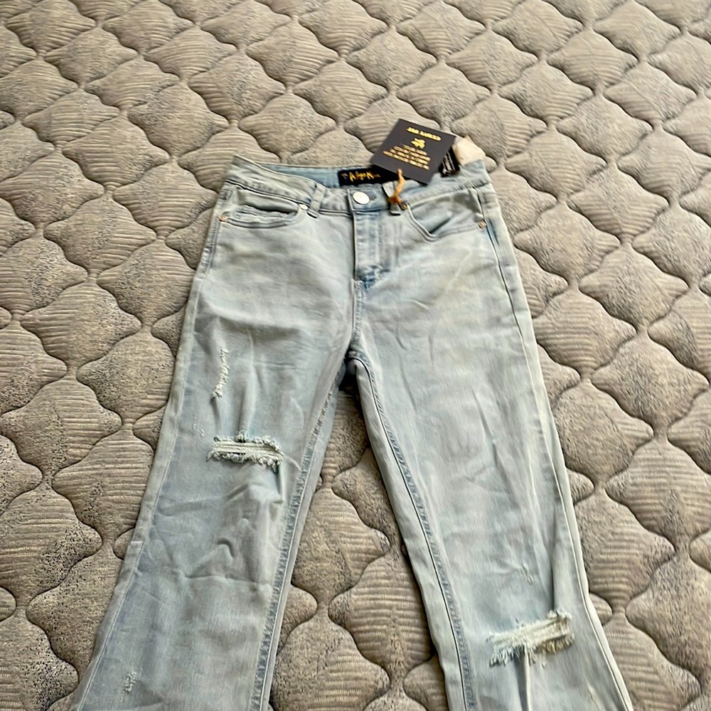 Light blue pair of jeans brand new indigo rein  size 7  W27 length 32 1/2